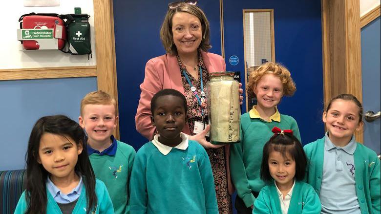 Henry Bloom Noble pupils with the time capsule