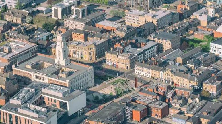 An aerial view of Barnsley shows a number of houses and other buildings