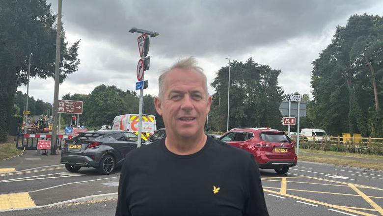 Mark Bodimeade with roadworks in the background.