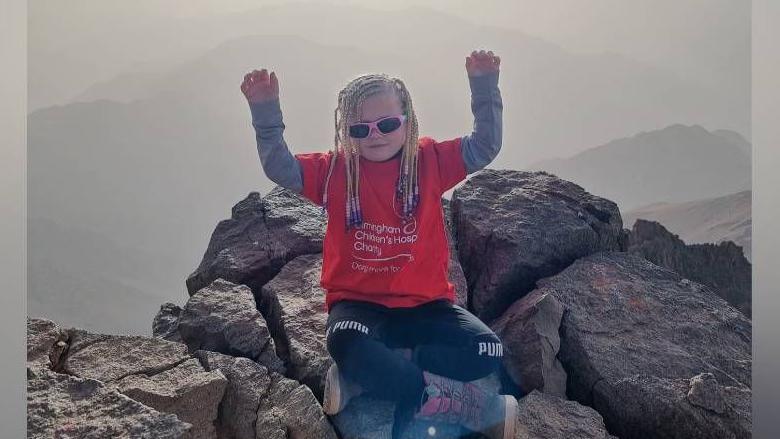 Seren on top of Mount Toubkal in Morocco
