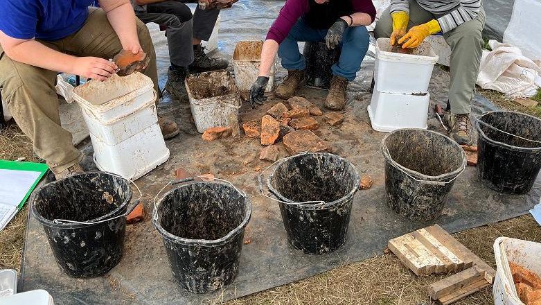 People's arms and hands with buckets and tiles