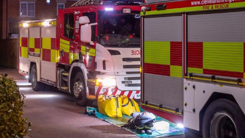 Fire engines and protective equipment in the street