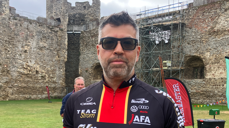 A head and shoulders image of Nick Khan, director at East Suffolk Council. He is wearing sunglasses and a cycling jersey.