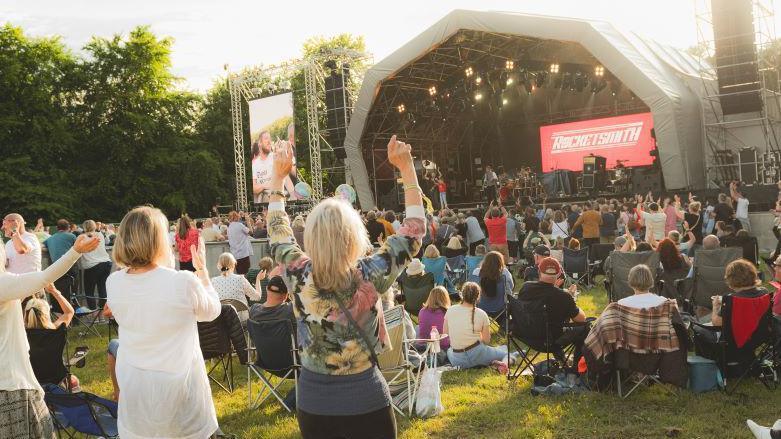 Crowds cheering and dancing as Rocketsmith perform on stage