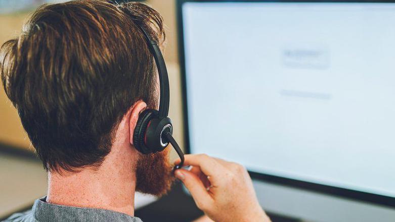 Call handler on the phone in an office