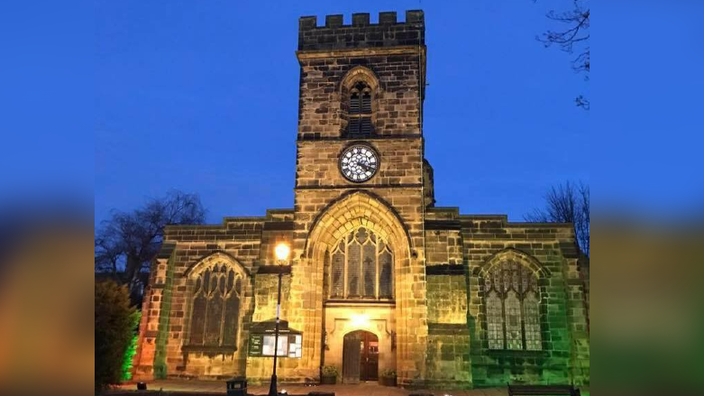 St Nicholas Church at night, with street lights in front