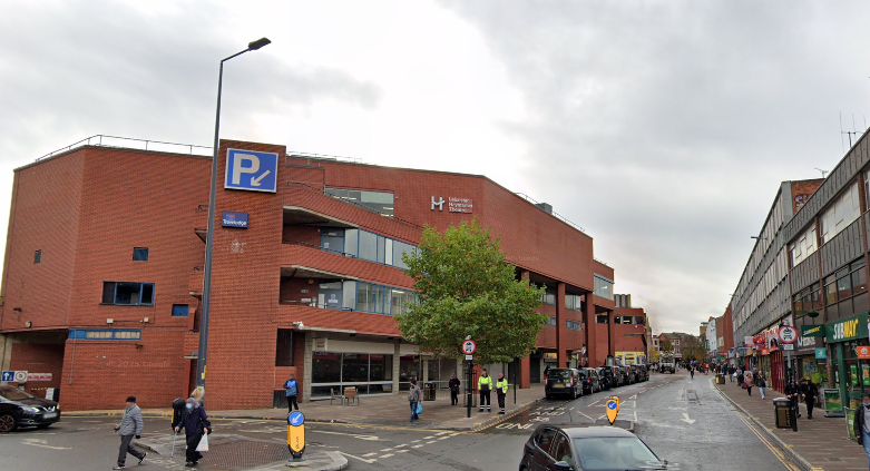 Exterior of Haymarket Shopping Centre, a red brick building with multiple storeys.