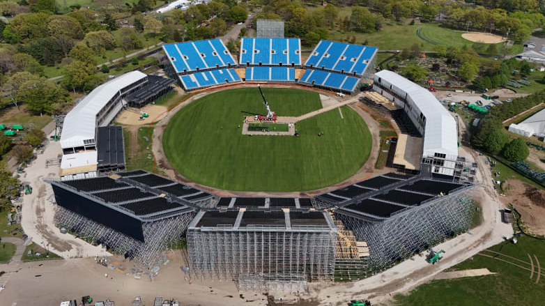 Drop-in pitches are lowered into the 34,000-seat stadium in Eisenhower Park in Nassau County