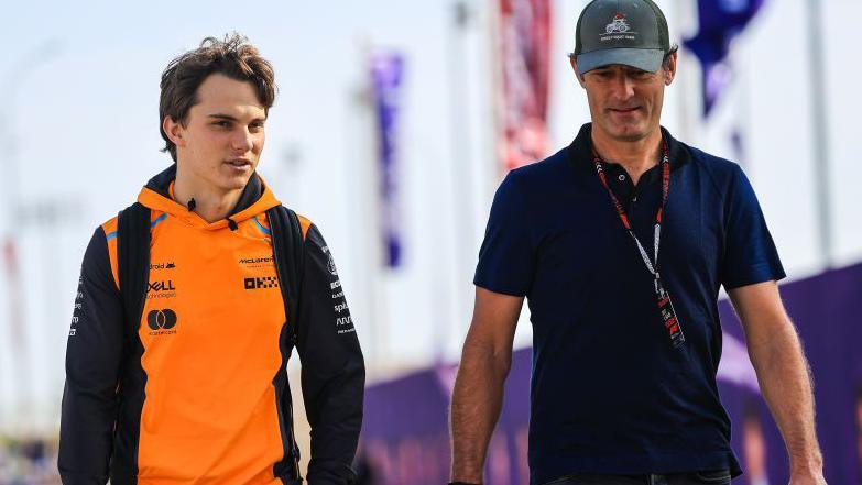 Oscar Piastri talks to his manager Mark Webber at the 2024 Qatar Grand Prix