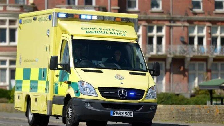 A South East Coast ambulance, with a firework display in the background