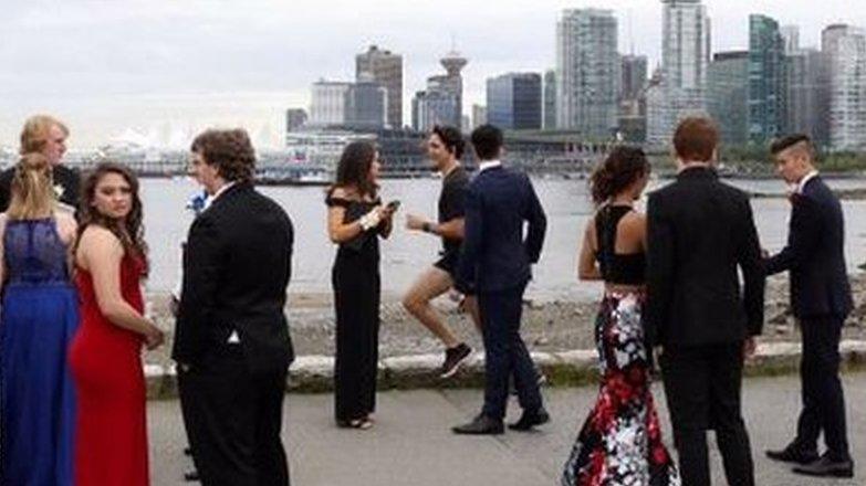 Justin Trudeau's official photographer tweeted a picture of him jogging past students in full prom regalia, captioned: "Prom season in #Vancouver"