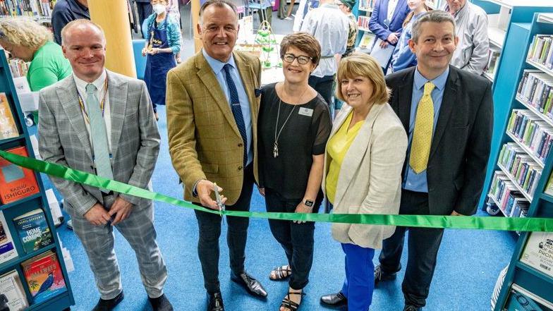 A ribbon cutting ceremony at a refurbished library in Sussex