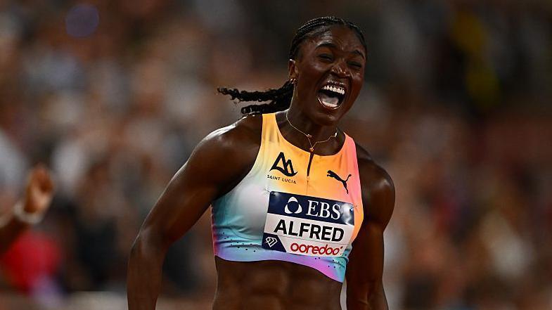 Julien Alfred celebrates winning the Monaco Diamond League 200m