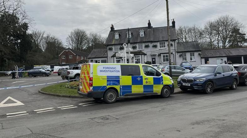 Police forensic van parked outside the Three Horseshoes pub in Knockholt