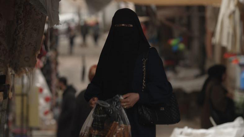 A woman is seen at a market in Jordan