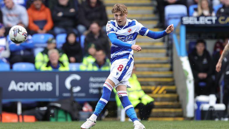 Charlie Savage strikes the ball for Reading