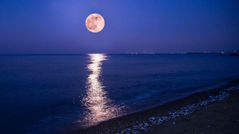 The Strawberry Moon, captured on a beach in June 2019.
