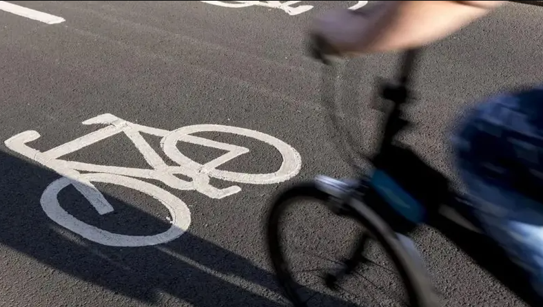 Cycling travelling over a cycle lane at speed