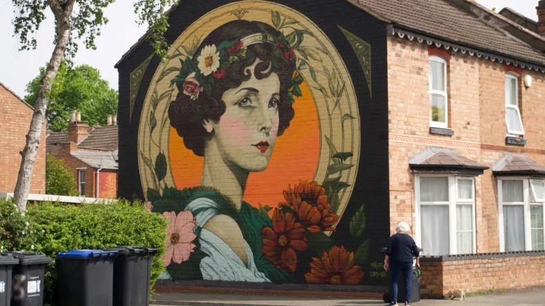 Art nouveau image of a woman on the side of a house