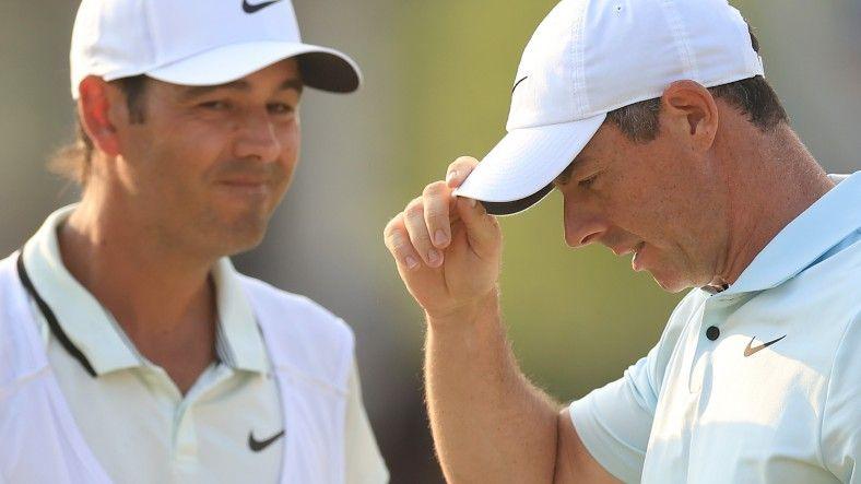 Rory McIlroy and his caddie Harry Diamond on the 18th green after missing out on winning the US Open