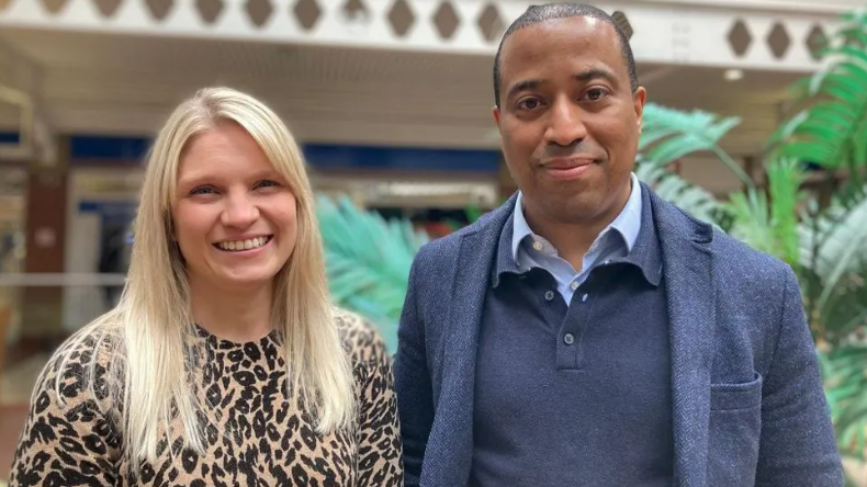 Danica Clements and Dane Cummings from Acorn Property Group stood in the shopping centre