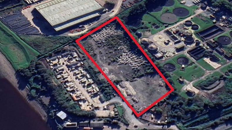 An aerial way of large amounts of waste on an unlicensed site in Queensferry. The site is marked inside a red boxed area 