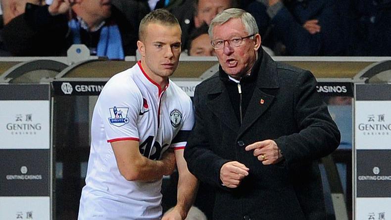 Tom Cleverley gets instructions off Manchester United manager Sir Alex Ferguson moments before coming off the bench