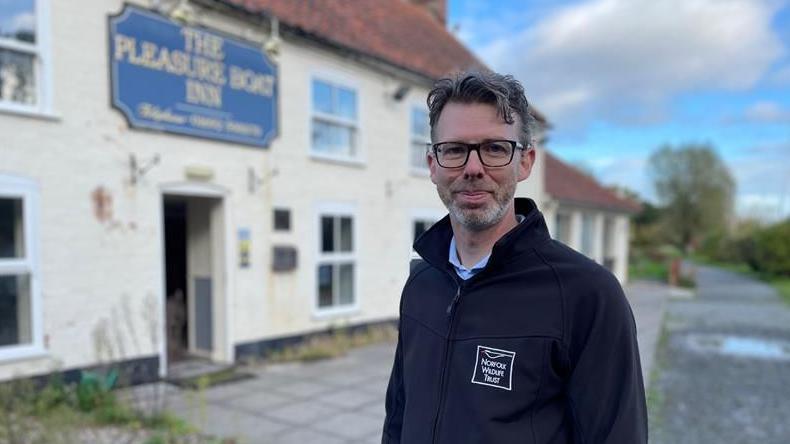 Eliot Lyne of the Norfolk Wildlife Trust standing outside the Pleasure Boat Inn at Hickling Broad