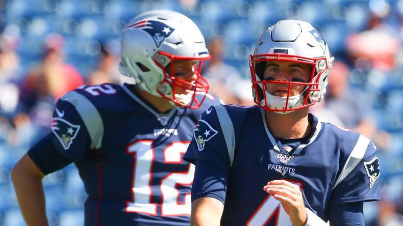 New England Patriots quarterbacks Tom Brady and Jarrett Stidham warm up during the 2019 season