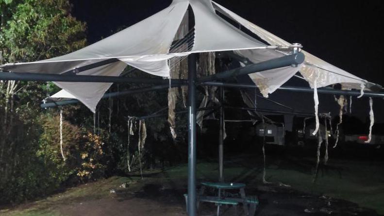 Damage to tarpaulin following a fire at a village hall in South Normanton, Derbyshire