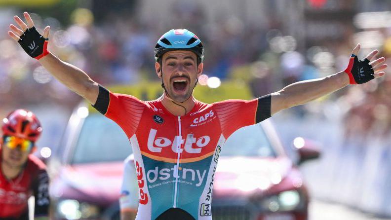 Victor Campenaerts celebrates winning stage 18 of the 2024 Tour de France