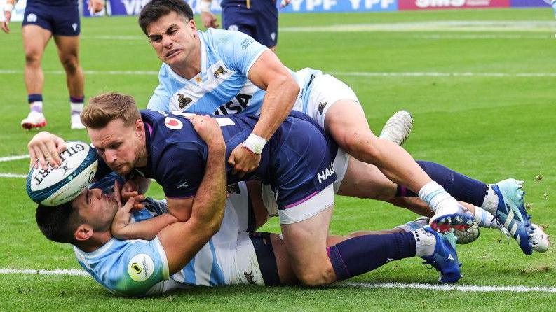 Scotland's Rory Hutchinson scores the third try in Cordoba