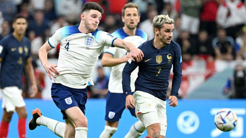 Declan Rice battles for the ball with Antoine Griezmann