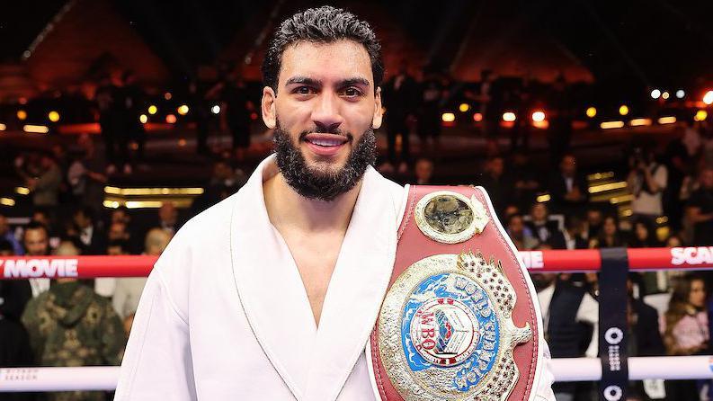 Hamzah Sheeraz has the WBO super-middleweight title over his shoulder