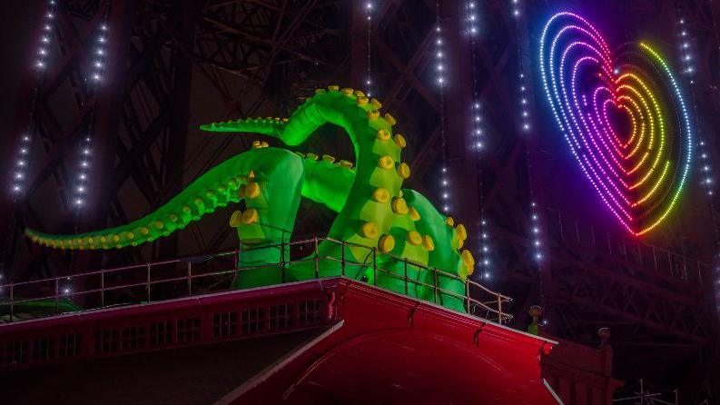 Giant inflatable tentacles created by Designs in Air called Invasion coming out of Blackpool Tower last year