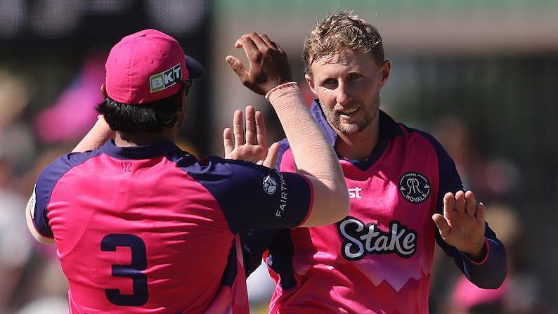 Former England captain Joe Root celebrates a wicket