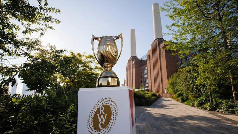 The new Women's Rugby World Cup trophy on a plinth outside Battersea Power Station