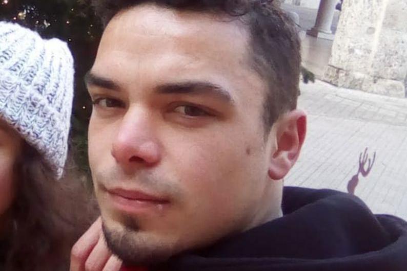Close-up of Leonard Farruku looking at the camera. He has smartly cropped dark hair and a stubble goatee beard and has a serious expression.