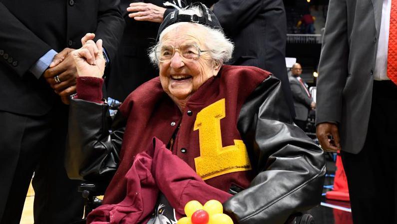 Sister Jean seated on the sidelines during the 2018 men's NCAA basketball tournament