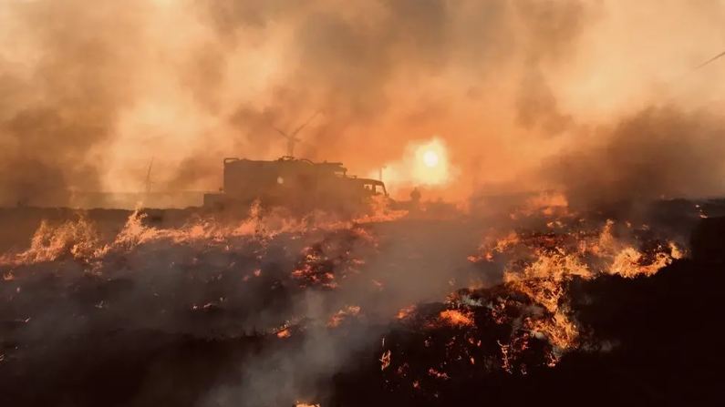 Teine monaidh aig Mòinteach an Damhath