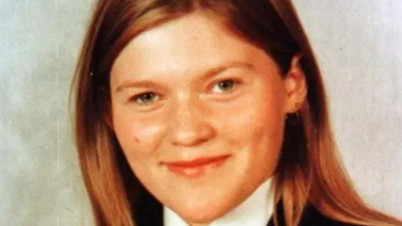 Headshot of a girl smiling at the camera. She is wearing a school uniform.