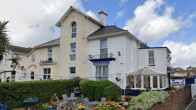 The Seacroft Guest House and Holly-Lets Apartments in Paignton with a garden terrace in front of the Seacroft Guest House.