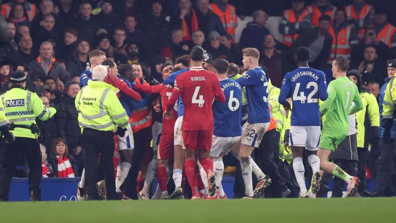 Everton and Liverpool players clashing immediately after the final whistle