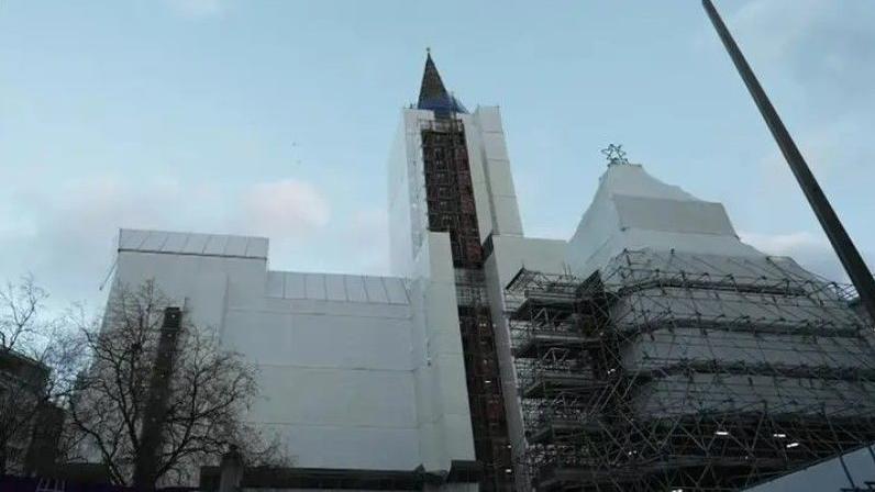 Scaffolding and covers on the exterior of Manchester's Town Hall. 