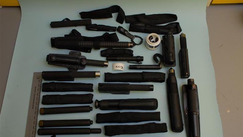 Over twenty batons are laid out
