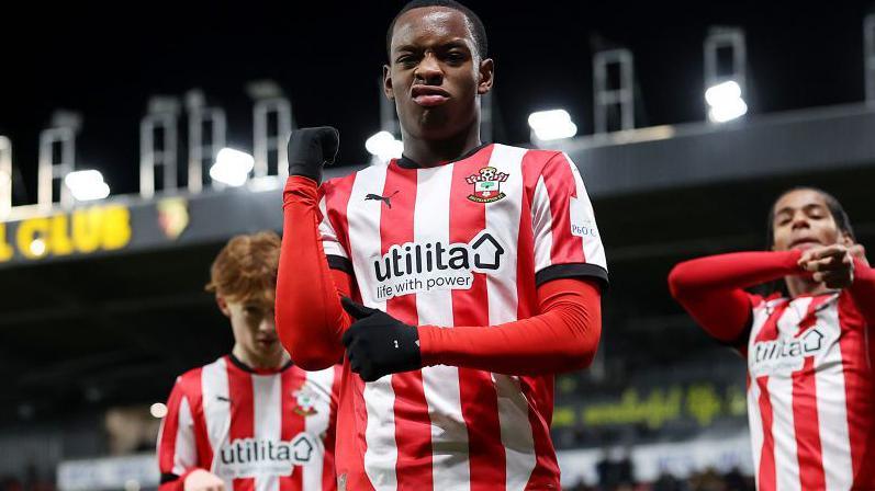 Southampton's Nick Oyekunle celebrates with a team-mate in background on either side