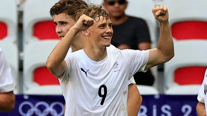 Ben Waine celebrates scoring for New Zealand at the 2024 Olympic Games