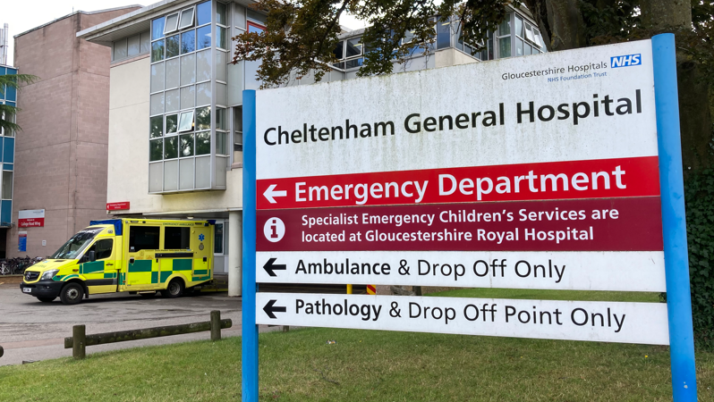 A sign saying it is the Cheltenham General Hospital Building, in front of the building