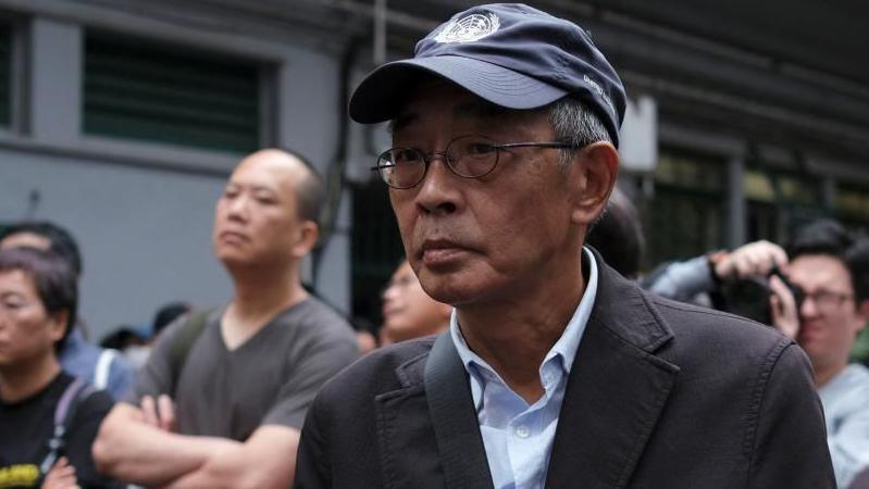 Bookseller Lam Wing-kee marches during a protest in Hong Kong to demand authorities scrap a proposed extradition bill with China. Photo: March 2019.