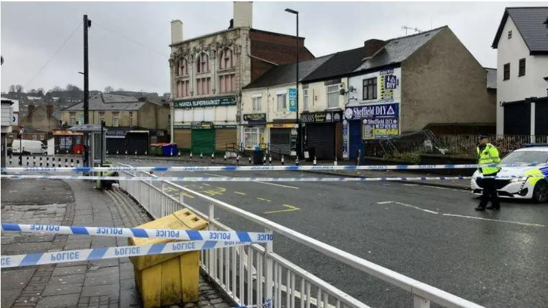 Police officers and a cordon at the crime scene